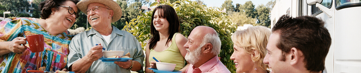 Family gathering outside and drinking coffee.