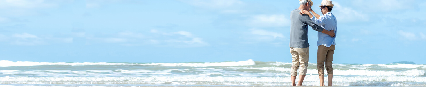 Couple dancing together by the beach.