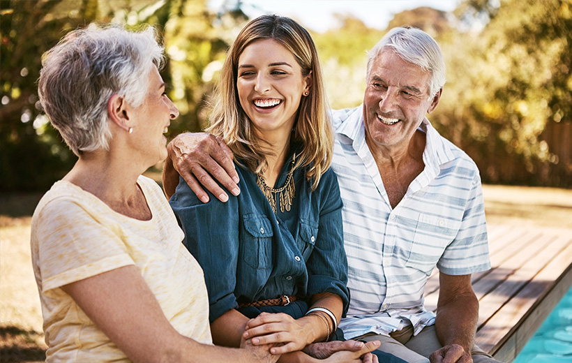 family smiling at each other